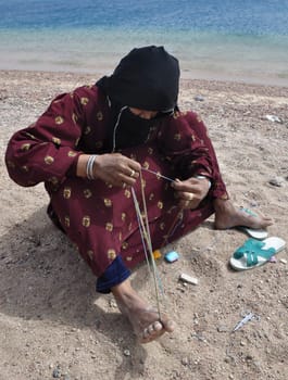 Bedouine Woman Makes Handcraft