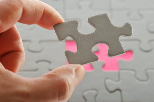 Puzzle and hand