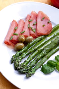 Green asparagus with olives,ham
