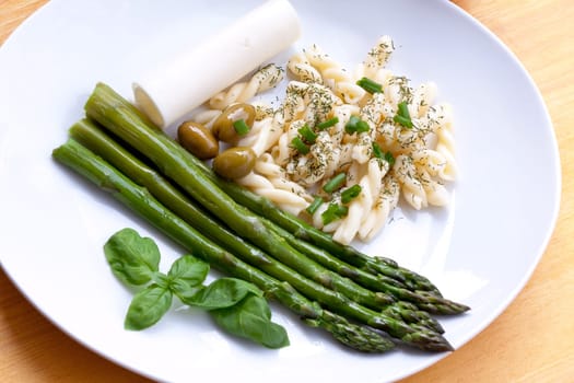Green asparagus with pasta,olives,cheese