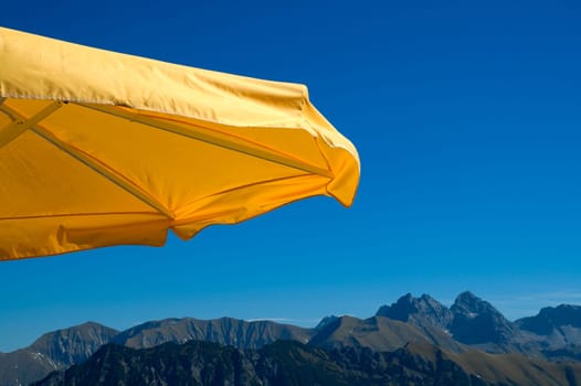 Yellow parasol and mountains
