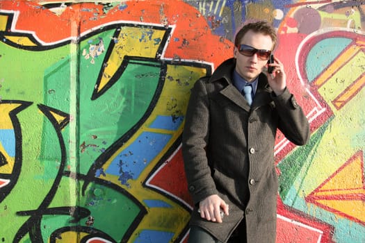 Businessman talking on the phone outdoors