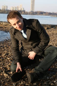 Man shows broken shoes