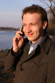 Man talking on the phone outside