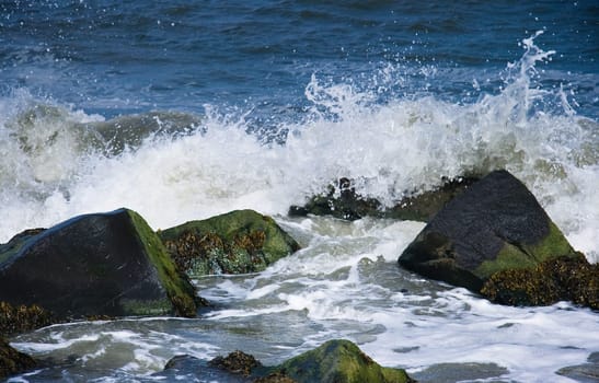 Rocks with breakers at the coast