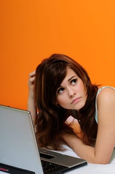 Girl with laptop in bed