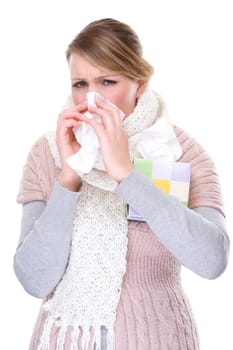 Woman blowing her nose