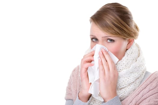 Woman blowing her nose