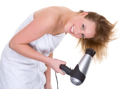 Young woman blow-drying her hair