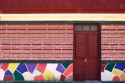 Red Door and Tiled Wall