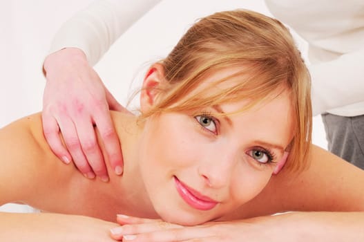 Blonde woman receives a relaxing massage