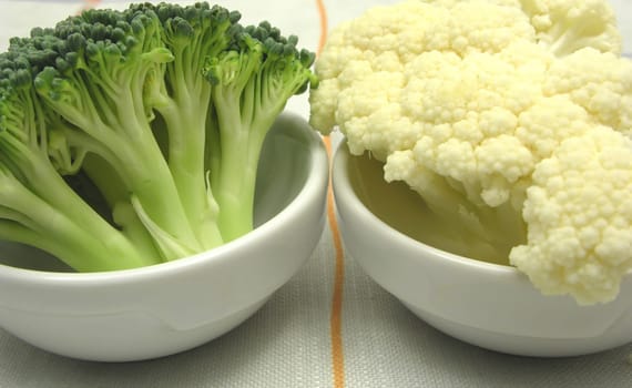Cauliflower and broccoli in small bowls