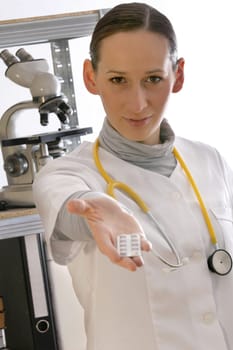 doctor giving pills