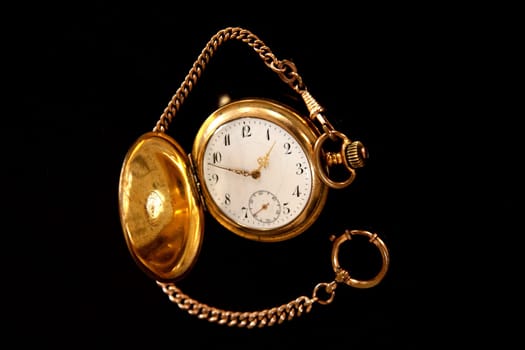 Gold pocket watch with chain