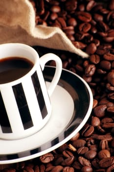 Coffee cup with coffee beans