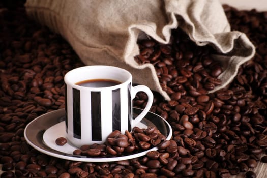 Coffee cup with coffee beans