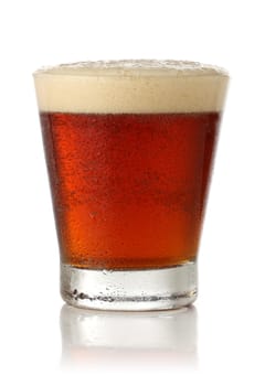 Fresh glass of beer isolated on white