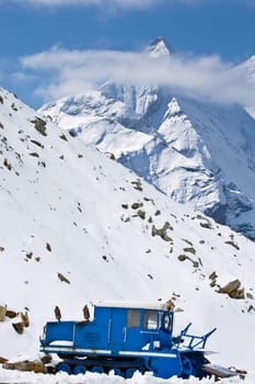 Snowplow in alpine road
