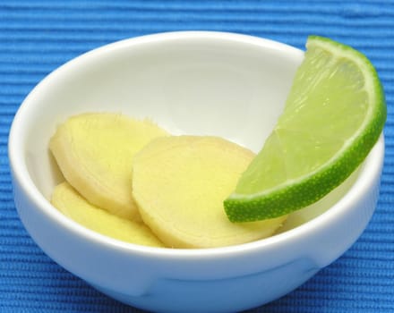 Ginger with lime in porcelain bowl