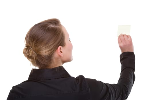 Businesswoman sticking notes on wall