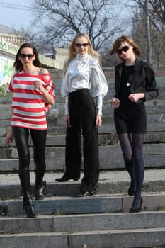 three women on the stairs