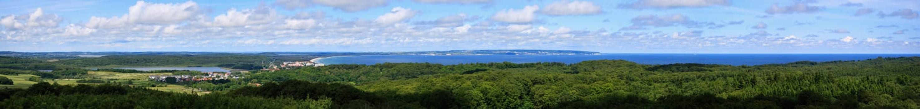 Island of Rügen,view to the north of Binz,the colossus of Prora,the ferry port in Neu Mukran,Sassnitz and the chalk coast. To the left of Binz is the Schmachter See,in the foreground the dense forest of Lancken-Granitz. Panorama was composed of 13 horizontal shapes