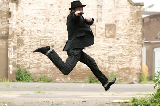 jumping man with gun