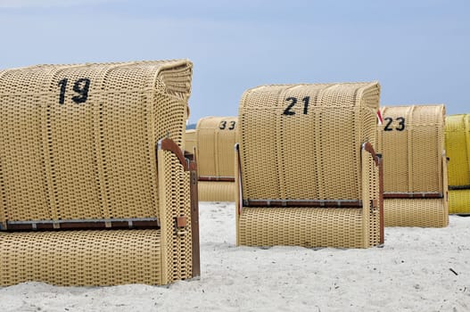 Some beach chairs seen from behind
