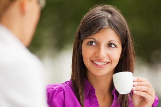 businesswomen drinking coffee
