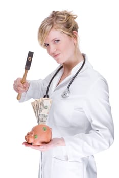 Young female doctor with piggy bank