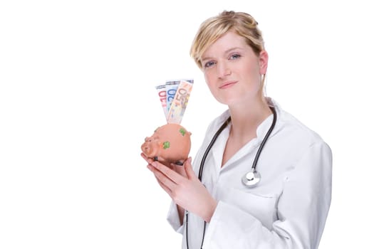 Young female doctor with piggy bank