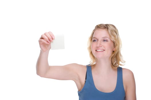 Businesswoman sticking notes on wall