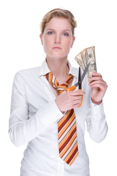 Young businesswoman slices money