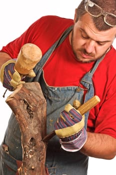 man and sculpture making