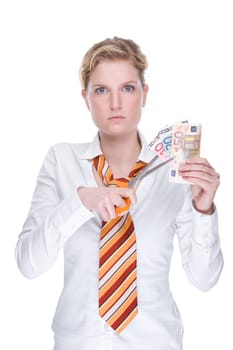 Young businesswoman slices money
