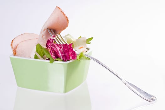 Mixed salad in green bowl