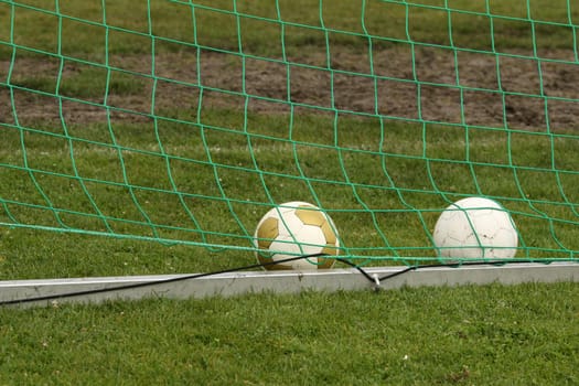 soccer balls in goal