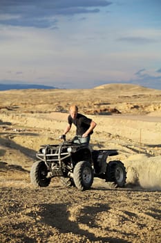 quad ATV in hills - teen on four wheeler