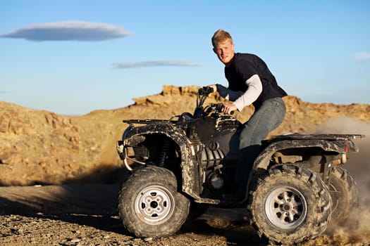 quad - teen driving four wheeler