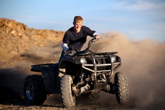 teenager riding quad ATV