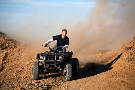 teenager riding quad four wheeler