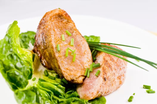 Pork tenderloin,fried on salad with chives