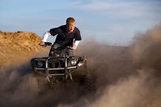 quad ATV kicking up dust