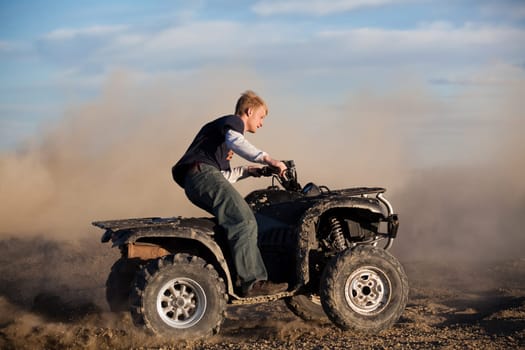 teen riding ATV quad