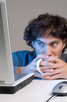 Tired man at computer desk