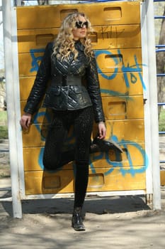 young woman at the wall