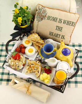 Delicious hearty breakfast tray prepared for a lazy Sunday morning.