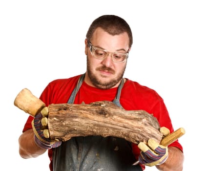 man and sculpture making