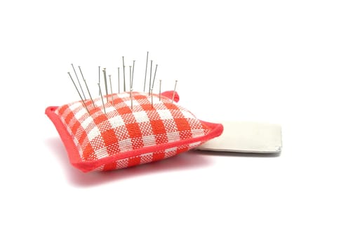 Pincushion with pins and cloth chalk