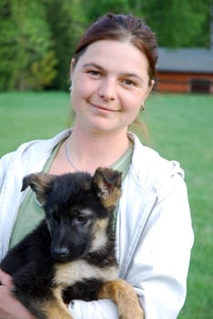 Woman with German Shepherd puppy